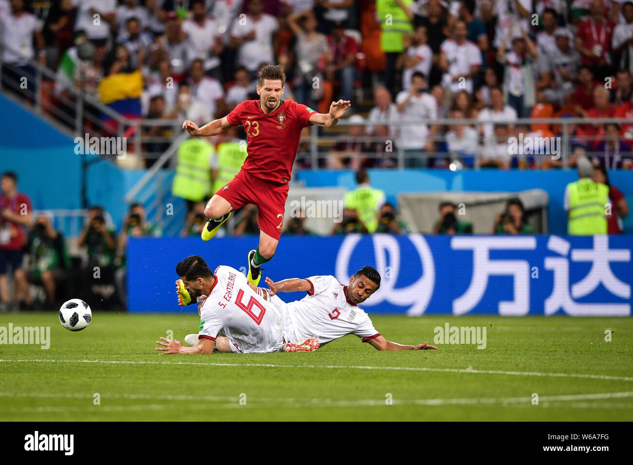 Adrien Silva of Portugal, top, challenges players of Iran in their Group B match during the 2018 FIFA World Cup in Saransk, Russia, 25 June 2018.   Af Stock Photo