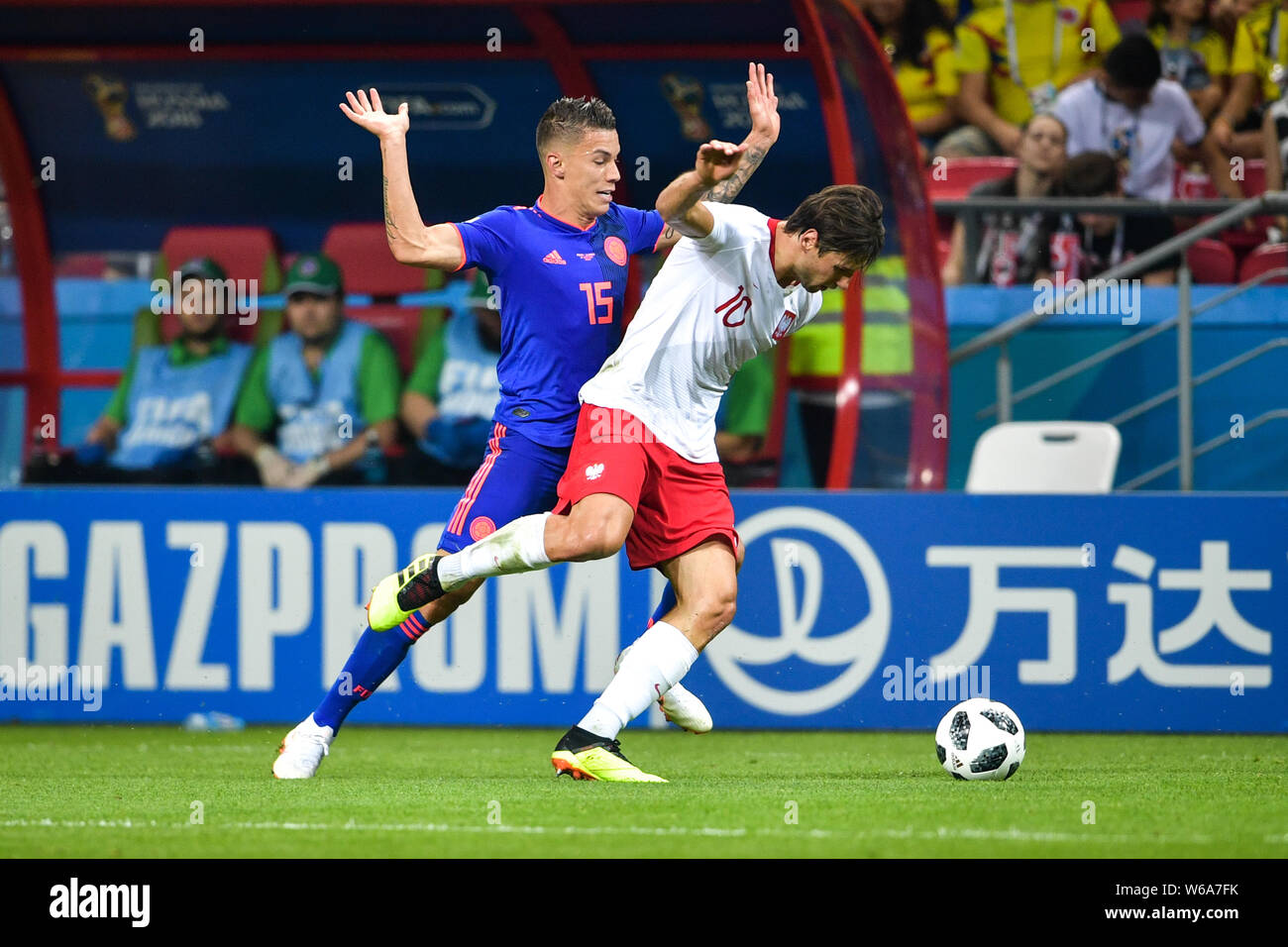 Mateus Uribe of Colombia, left, challenges Grzegorz Krychowiak of Poland in their Group H match during the FIFA World Cup 2018 in Kazan, Russia, 24 Ju Stock Photo