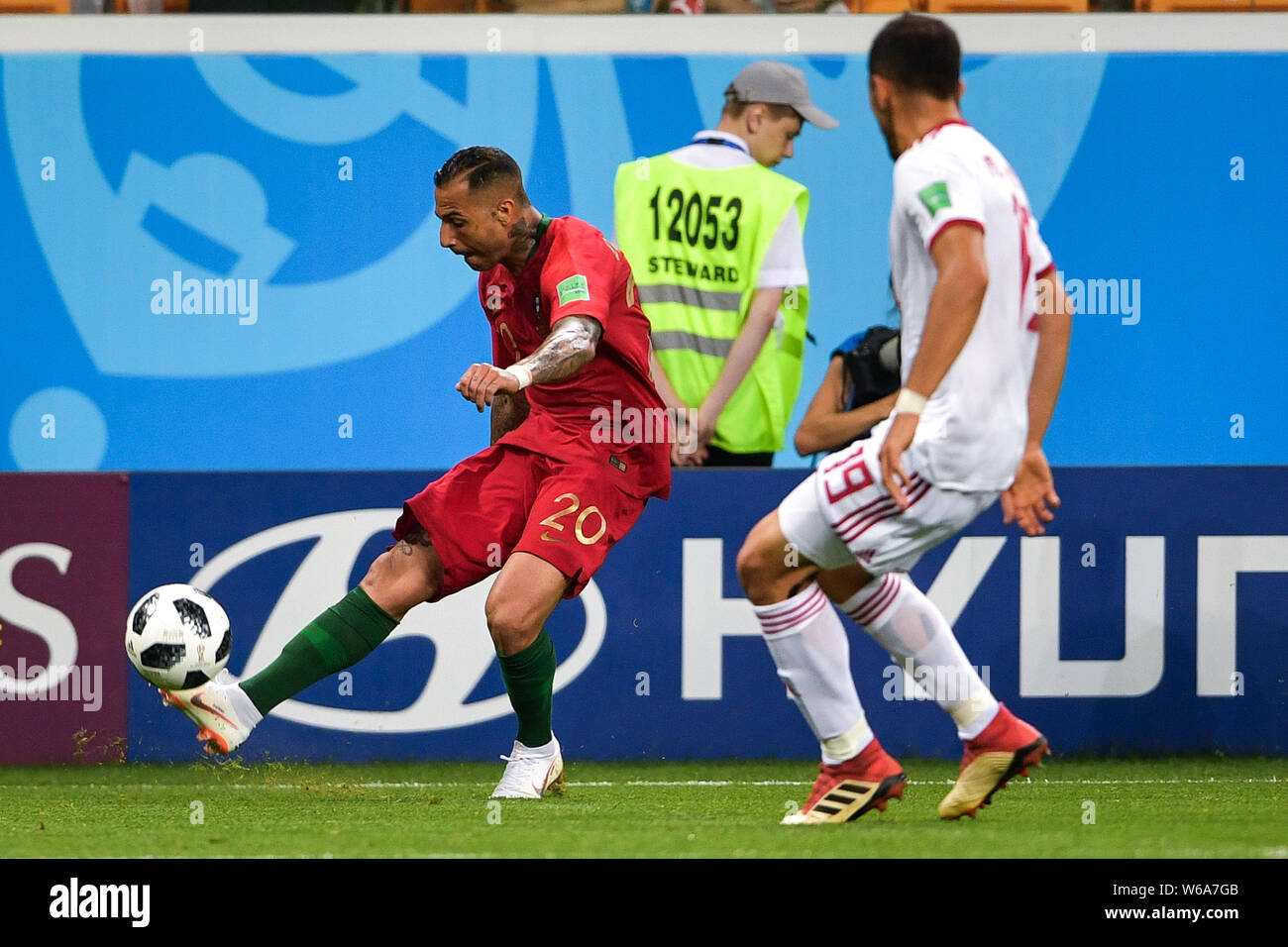 Ricardo Quaresma of Portugal, left, makes a pass against Majid Hosseini of Iran in their Group B match during the 2018 FIFA World Cup in Saransk, Russ Stock Photo
