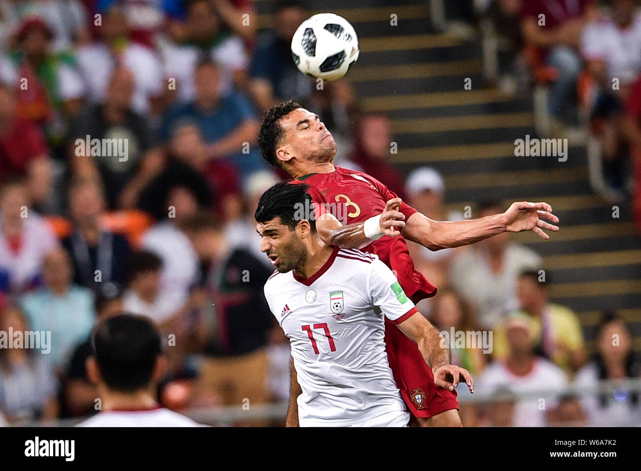 Pepe of Portugal, back, heads the ball against Mehdi Taremi of Iran in  their Group B match during the 2018 FIFA World Cup in Saransk, Russia, 25  June Stock Photo - Alamy