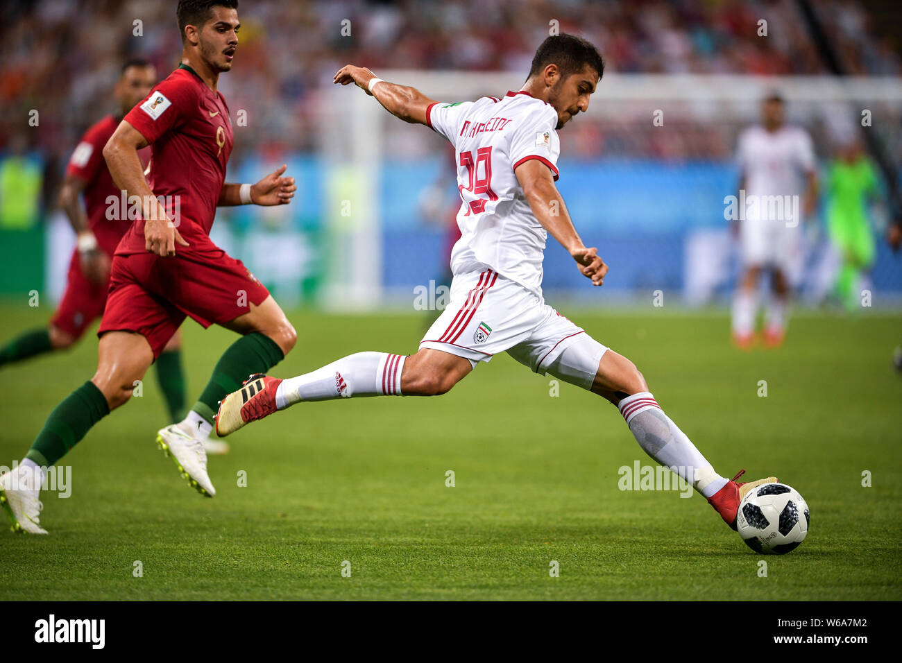 Majid Hosseini of Iran, right, shoots against Andre Silva of Portugal in their Group B match during the 2018 FIFA World Cup in Saransk, Russia, 25 Jun Stock Photo