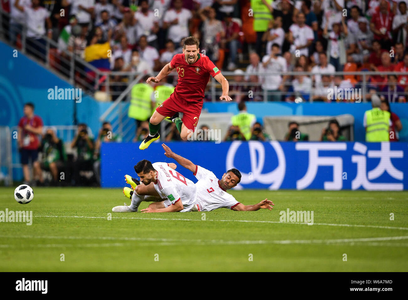 Adrien Silva of Portugal, top, challenges players of Iran in their Group B match during the 2018 FIFA World Cup in Saransk, Russia, 25 June 2018.   Af Stock Photo