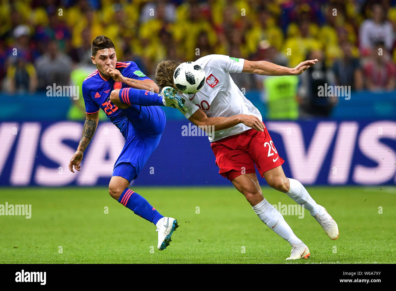 Lukasz Piszczek of Poland, right, challenges Juan Fernando Quintero of Colombia in their Group H match during the FIFA World Cup 2018 in Kazan, Russia Stock Photo