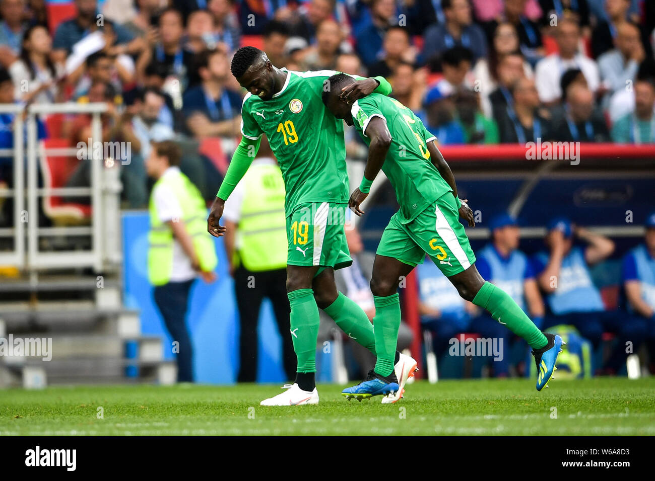 Idrissa Gueye, right, of Senegal celebrates with M'Baye Niang after causing an own goal against Poland in their Group H match during the FIFA World Cu Stock Photo