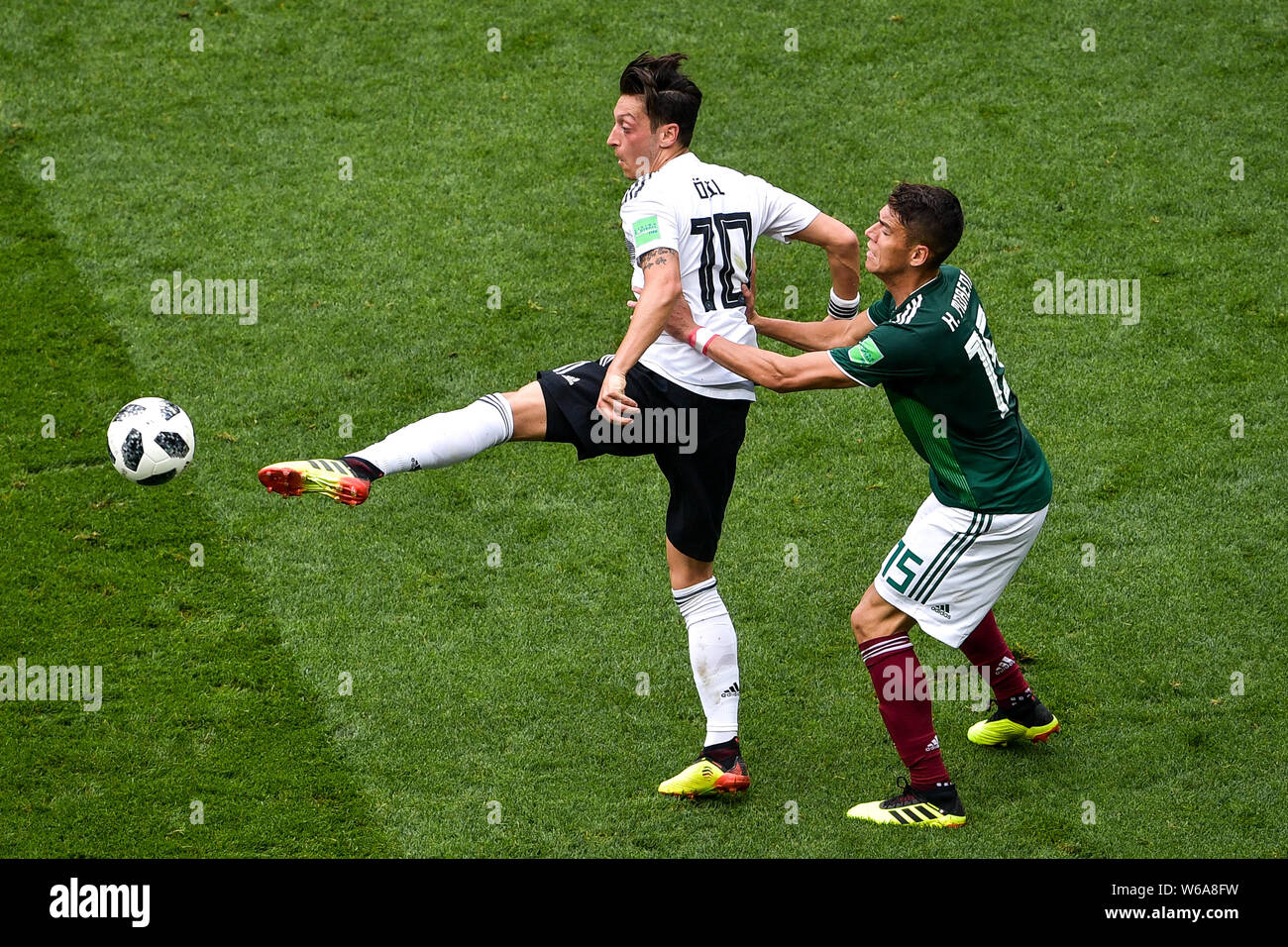 Hector Moreno of Mexico, right, challenges Mesut Ozil (Oezil) of Germany in their Group F match during the 2018 FIFA World Cup in Moscow, Russia, 17 J Stock Photo