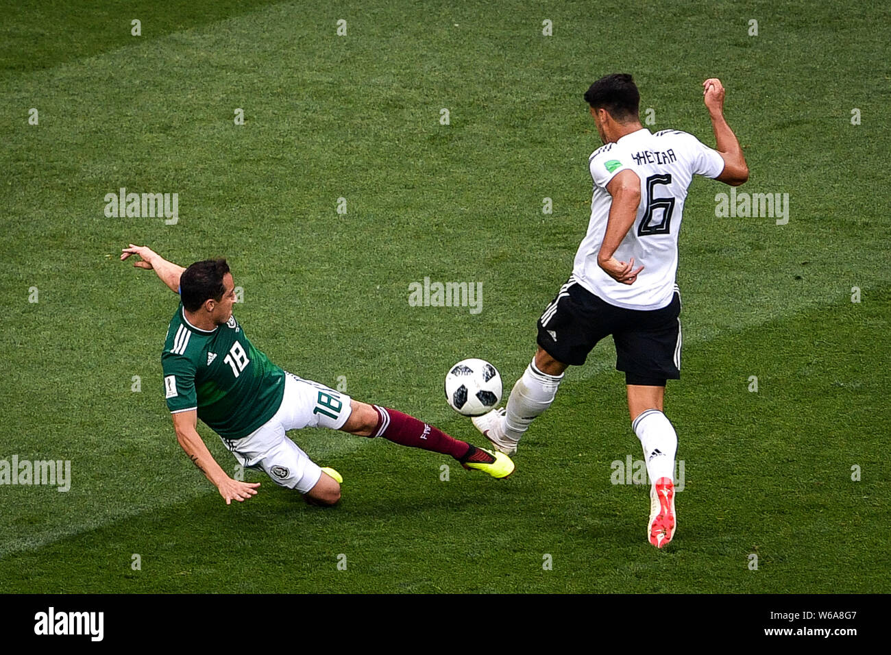 Andres Guardado of Mexico, left, challenges Sami Khedira of Germany in their Group F match during the 2018 FIFA World Cup in Moscow, Russia, 17 June 2 Stock Photo