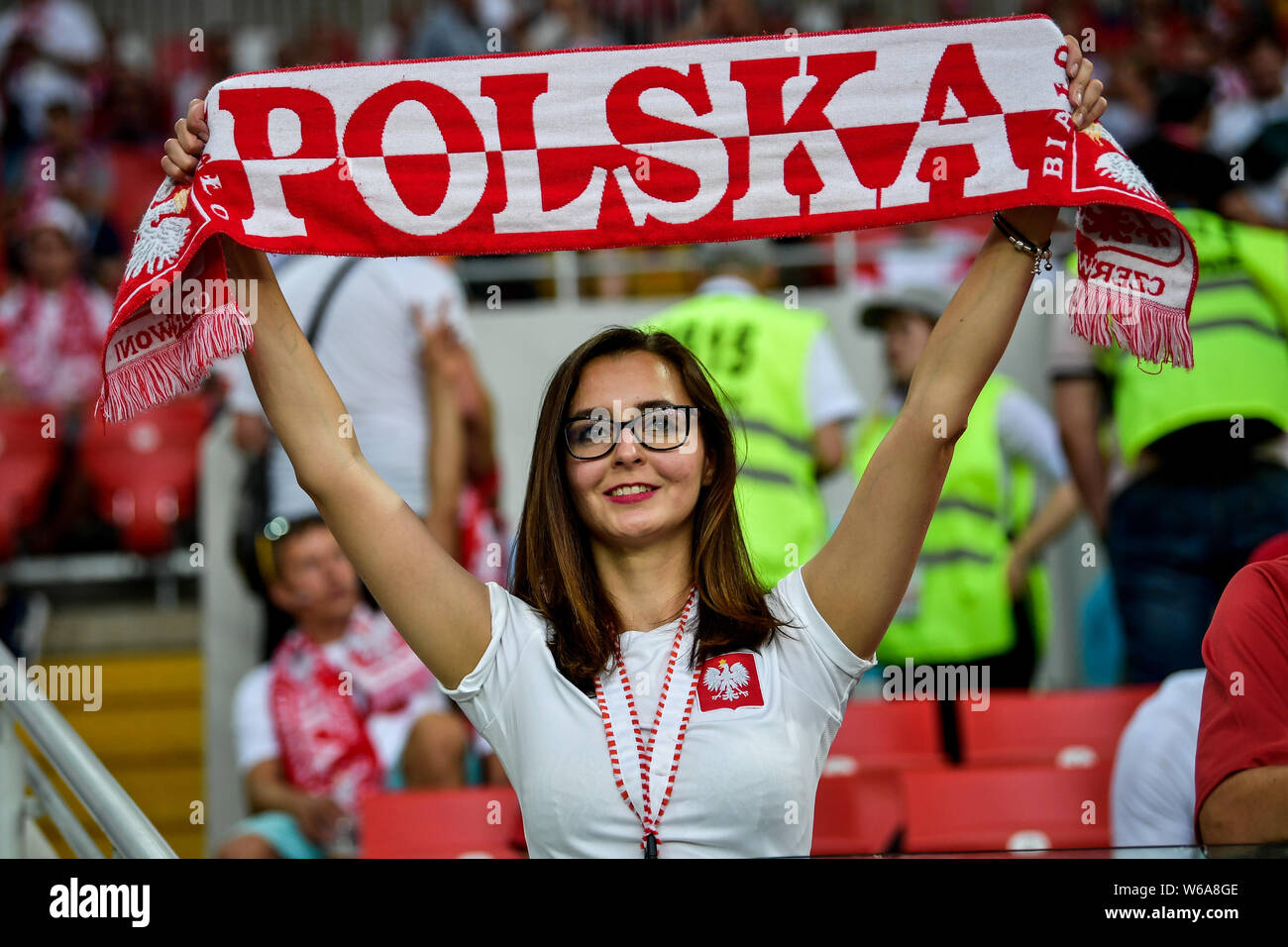 A hot female Polish fan wearing a red and white jersey watches the Group H  match between Poland and Senegal during the 2018 FIFA World Cup in Moscow  Stock Photo - Alamy
