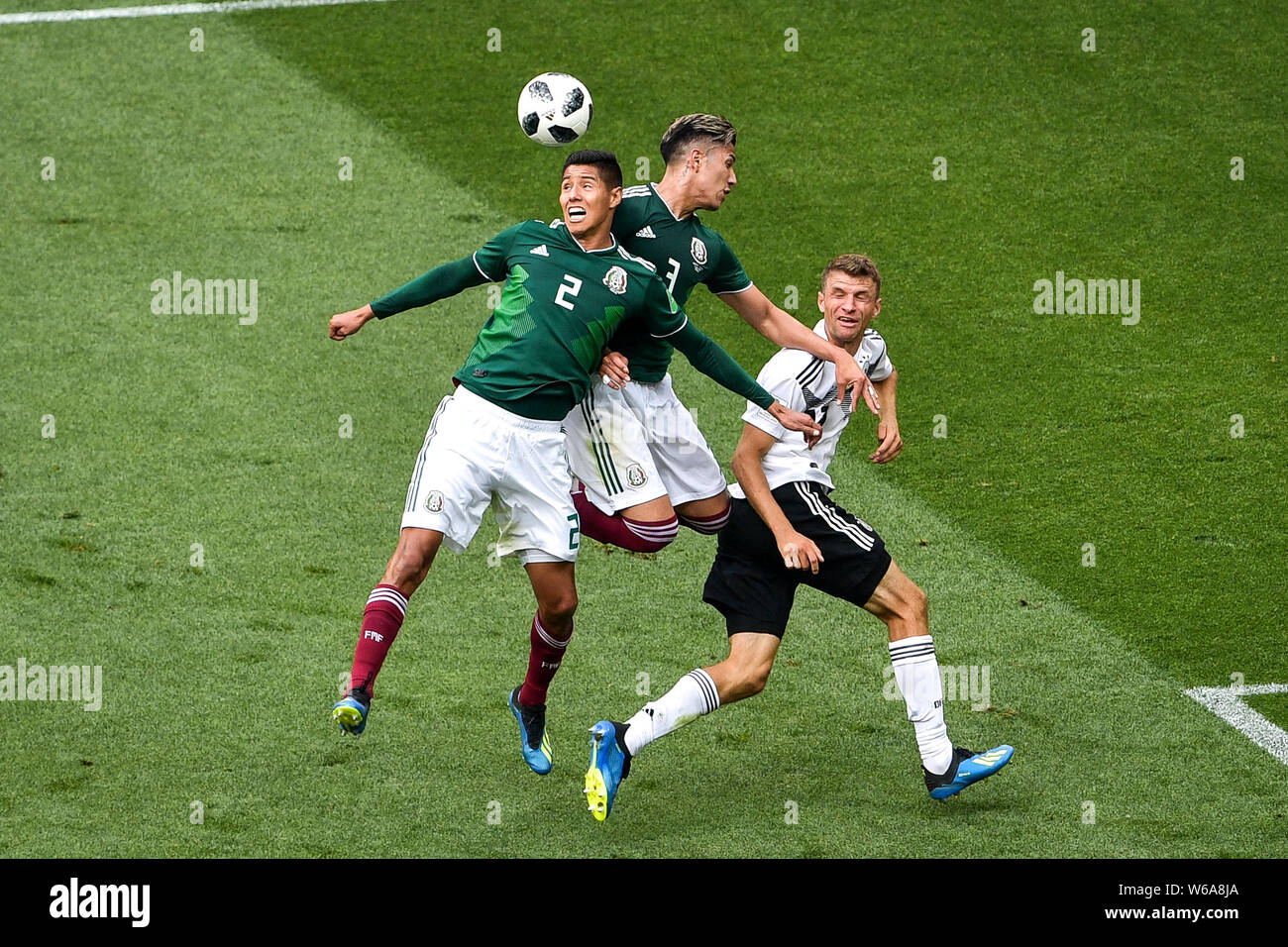 Hugo Ayala of Mexico, left, challenges Thomas Muller (Mueller) of Germany in their Group F match during the 2018 FIFA World Cup in Moscow, Russia, 17 Stock Photo