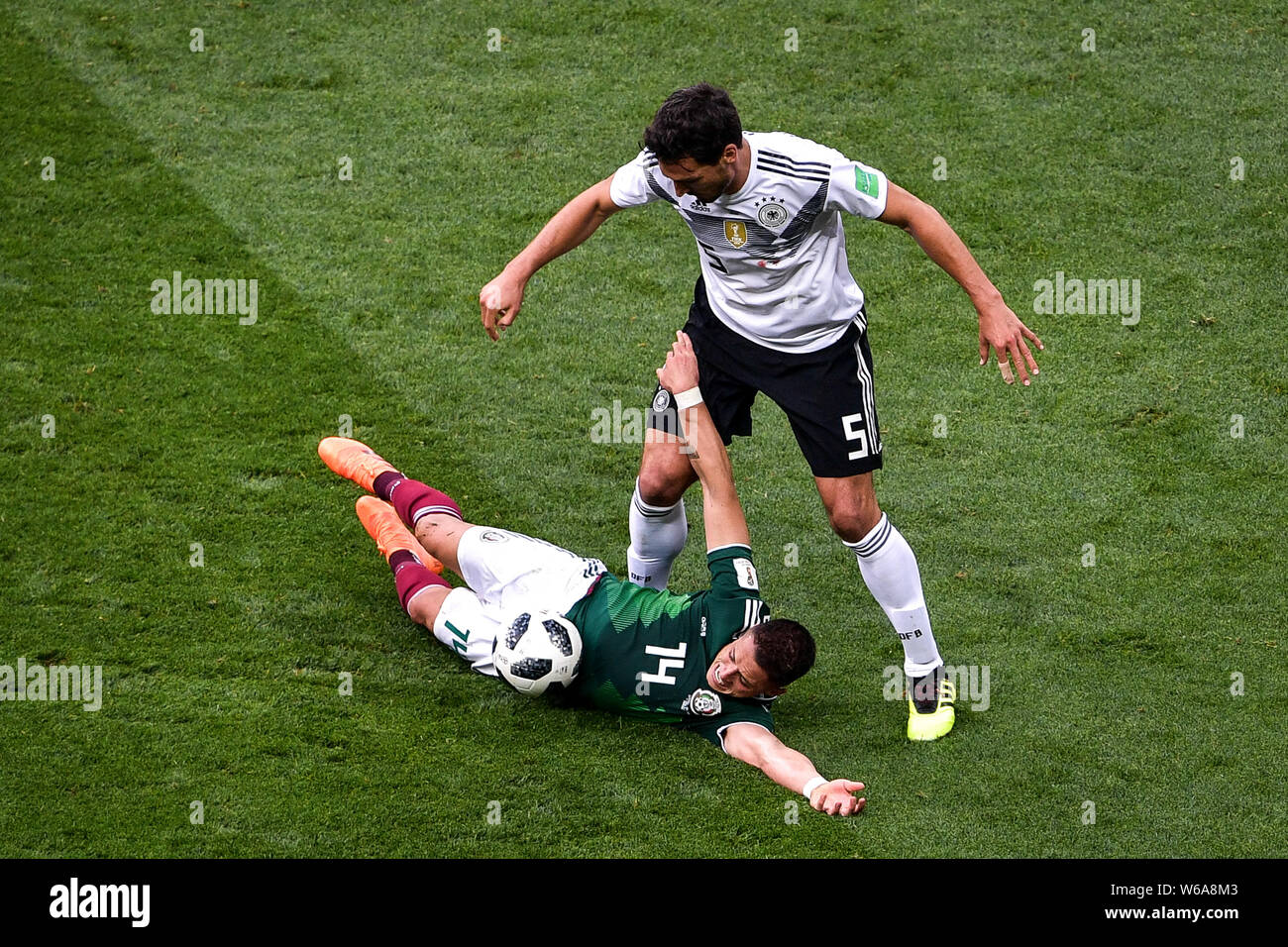 Javier Hernandez of Mexico, left, challenges Mats Hummels of Germany in their Group F match during the 2018 FIFA World Cup in Moscow, Russia, 17 June Stock Photo