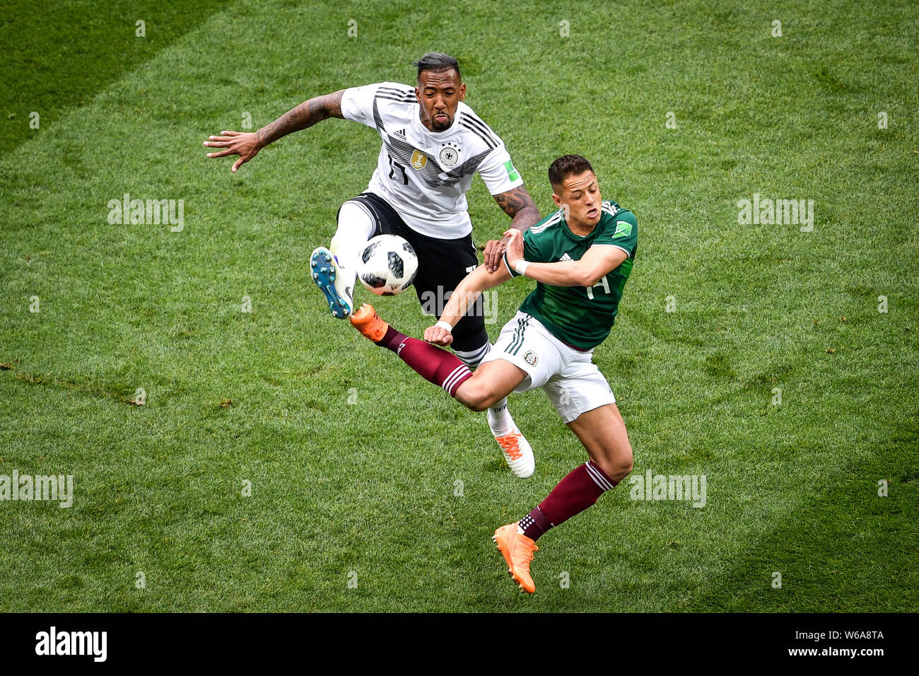 Jerome Boateng of Germany, left, challenges Javier Hernandez of Mexico in their Group F match during the FIFA World Cup 2018 in Moscow, Russia, 17 Jun Stock Photo