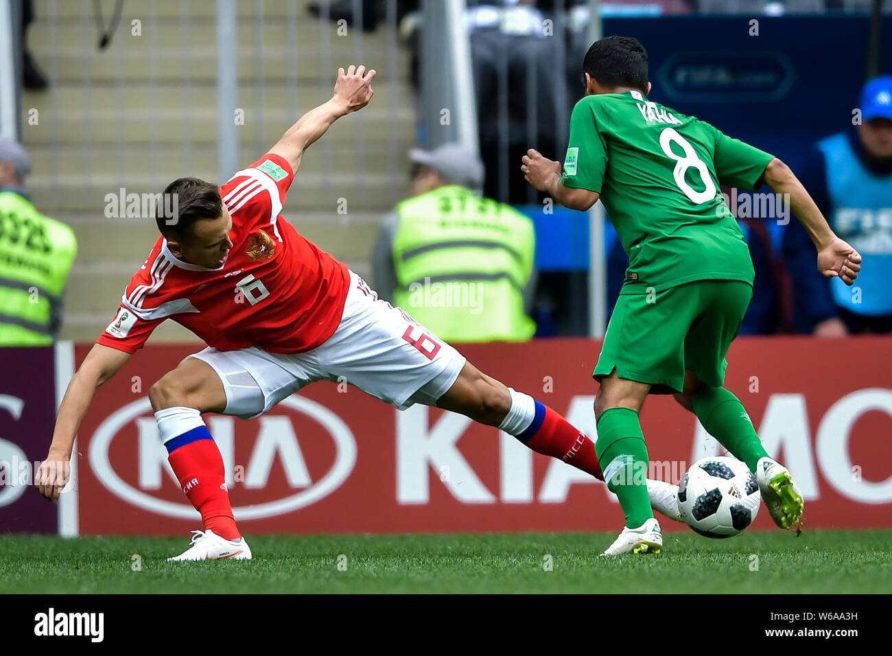 Denis Cheryshev of Russia, left, challenges Yahya Al-Shehri of Saudi Arabia in their Group A match during the 2018 FIFA World Cup in Moscow, Russia, 1 Stock Photo