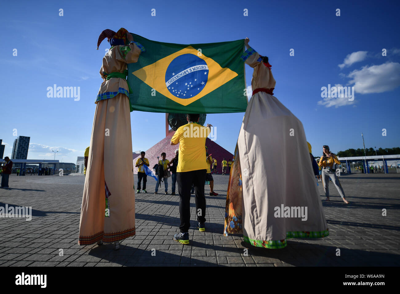 Brazilian fans are dressed up as they gather outside the Spartak Stadium before the group E match between Brazil and Serbia during the FIFA World Cup Stock Photo