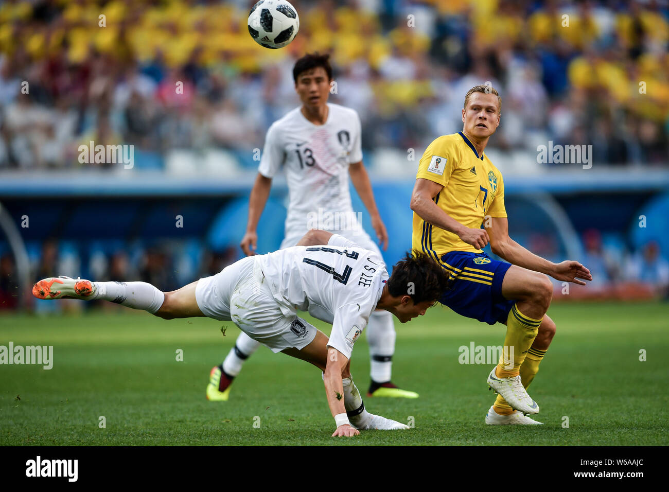 Viktor Claesson of Sweden, right, challenges Lee Jae-sung of South Korea in their Group F match during the FIFA World Cup 2018 in Nizhny Novgorod, Rus Stock Photo