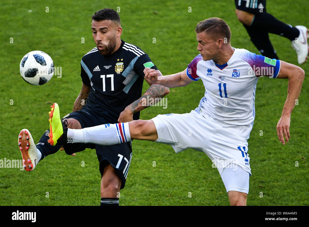 Nicolas Otamendi of Argentina, left, challenges Alfred Finnbogason of Iceland in their Group D match during the FIFA World Cup 2018 in Moscow, Russia, Stock Photo