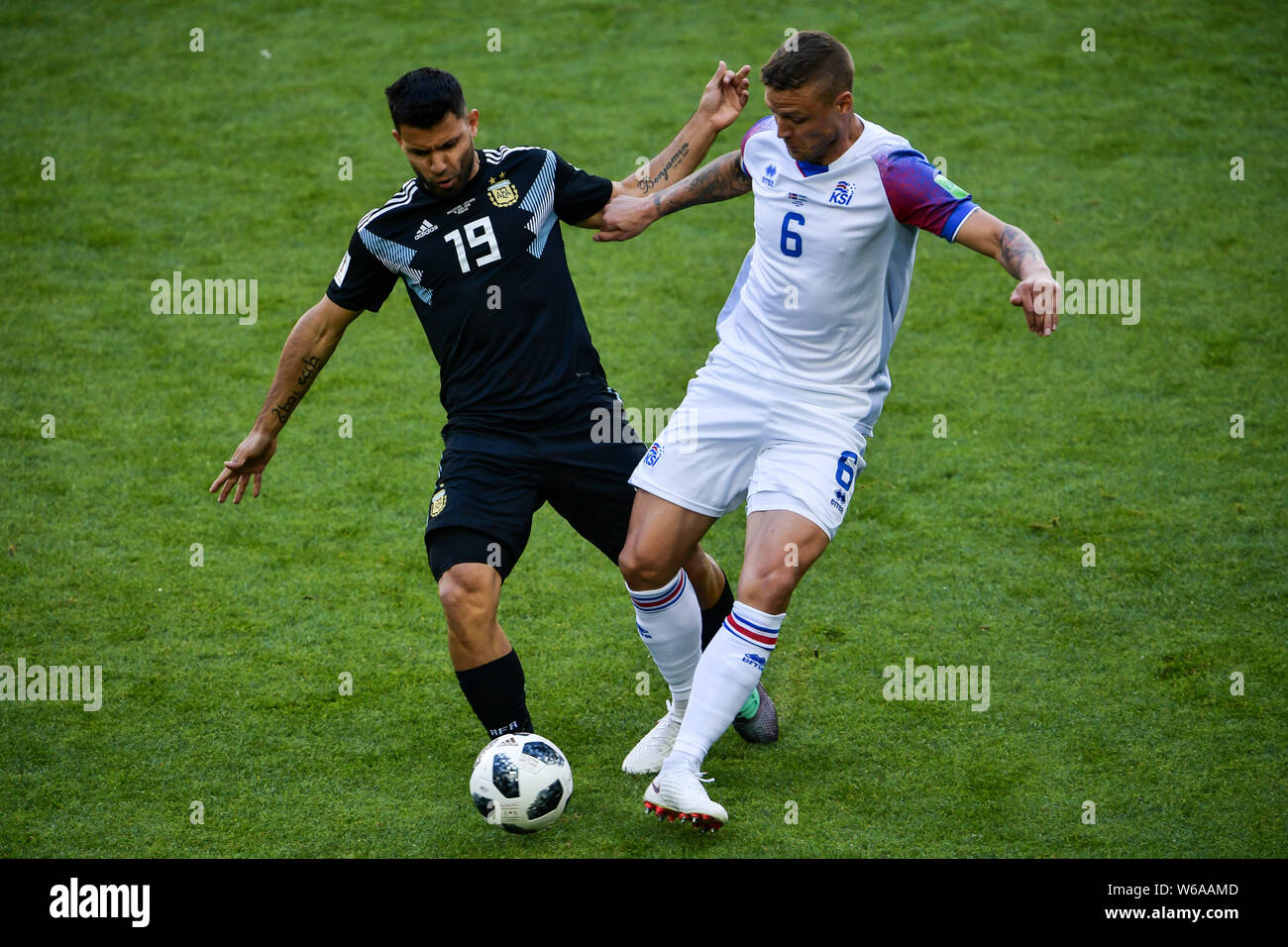 Sergio Aguero of Argentina, left, challenges Ragnar Sigurdsson of Iceland in their Group D match during the FIFA World Cup 2018 in Moscow, Russia, 16 Stock Photo