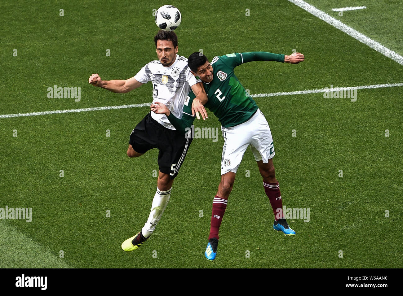 Hugo Ayala of Mexico, right, challenges Mats Hummels of Germany in their Group F match during the FIFA World Cup 2018 in Moscow, Russia, 17 June 2018. Stock Photo