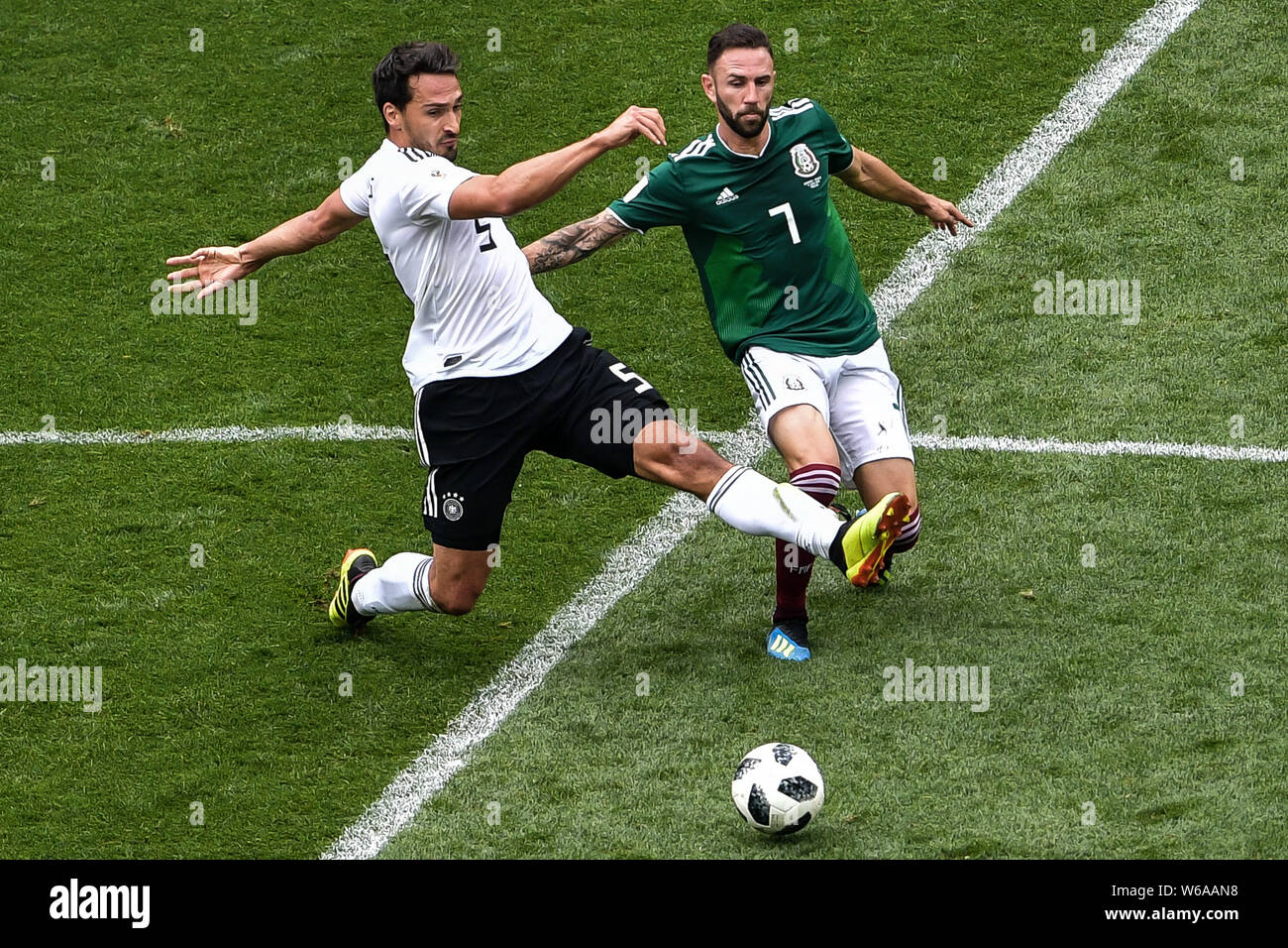 Miguel Layun of Mexico, right, challenges Mats Hummels of Germany in their Group F match during the FIFA World Cup 2018 in Moscow, Russia, 17 June 201 Stock Photo