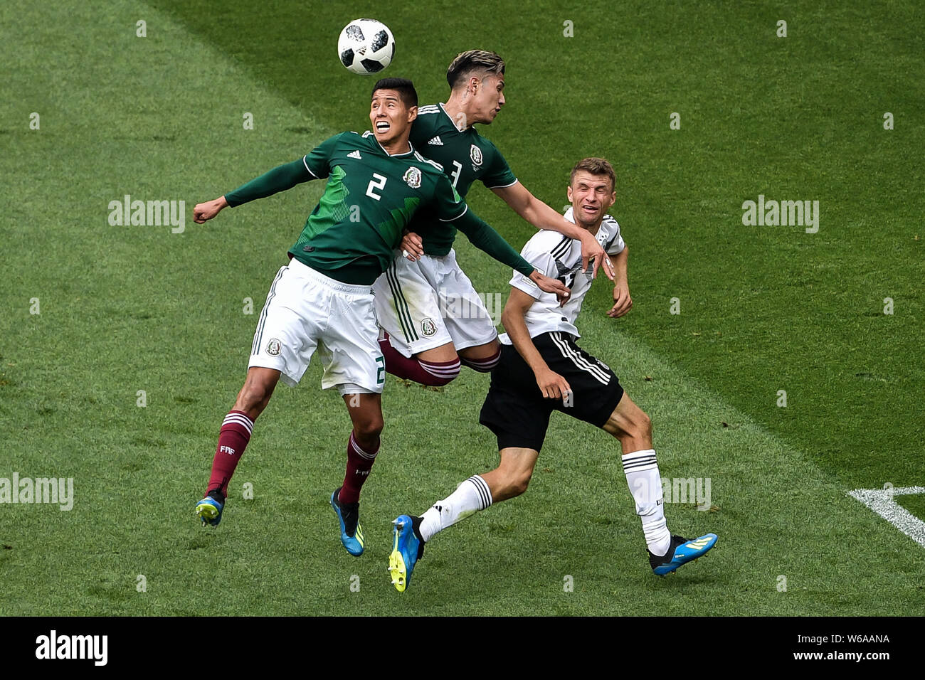 (From left) Hugo Ayala and Carlos Salcedo of Mexico challenge Thomas Mueller (Muller) of Germany in their Group F match during the FIFA World Cup 2018 Stock Photo