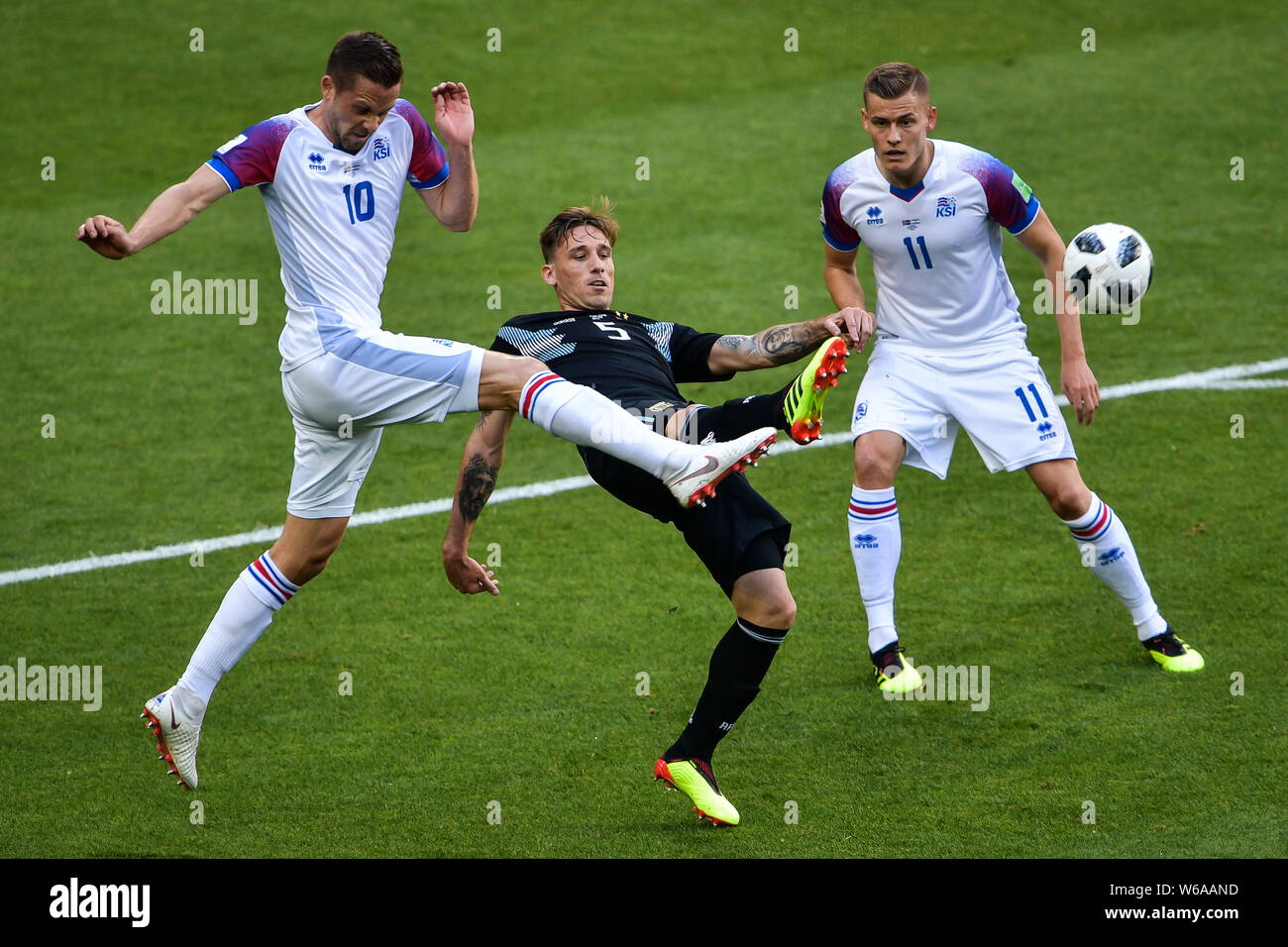 Lucas Biglia of Argentina, center, challenges Gylfi Sigurdsson, left, of Iceland in their Group D match during the FIFA World Cup 2018 in Moscow, Russ Stock Photo