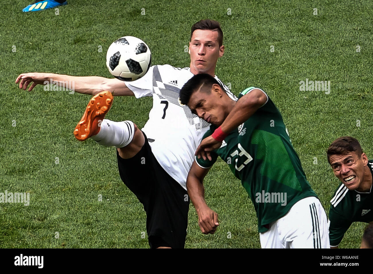 Julian Draxler of Germany, left, challenges Jesus Gallardo of Mexico in their Group F match during the FIFA World Cup 2018 in Moscow, Russia, 17 June Stock Photo
