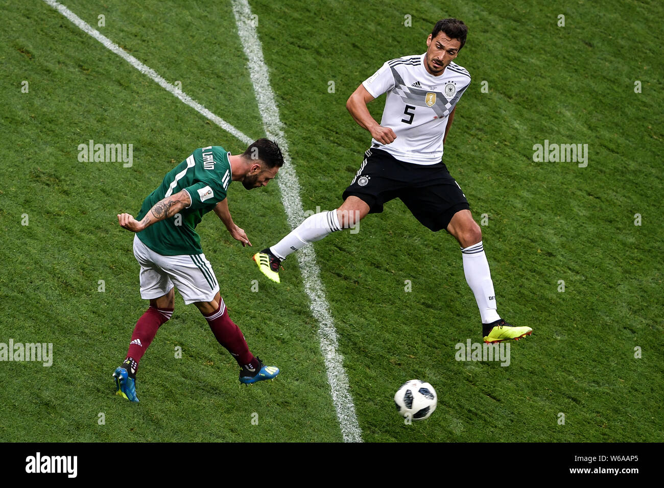 Mats Hummels of Germany, right, tries to block a shot by Miguel Layun of Mexico in their Group F match during the FIFA World Cup 2018 in Moscow, Russi Stock Photo