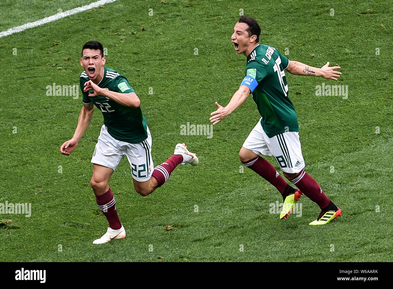 Hirving Lozano, left, of Mexico celebrates with Andres Guardado after scoring a goal against Germany in their Group F match during the FIFA World Cup Stock Photo