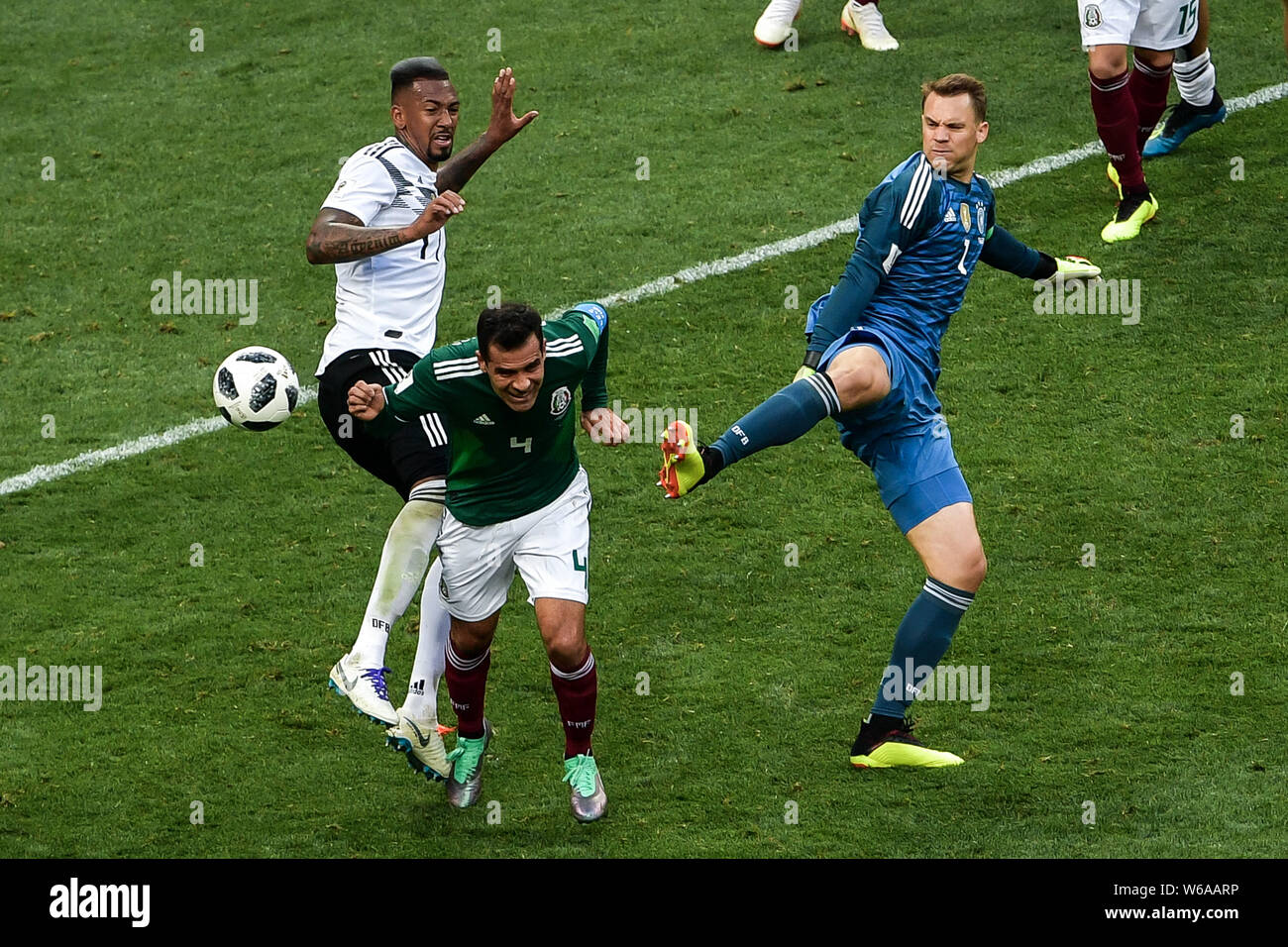 Rafael Marquez of Mexico, center, challenges Jerome Boateng, left, and goalkeeper Manuel Neuer of Germany in their Group F match during the FIFA World Stock Photo