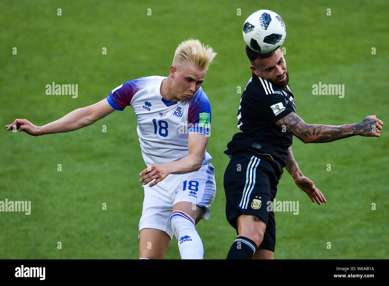 Nicolas Otamendi of Argentina, right, challenges Hordur Bjorgvin Magnusson of Iceland in their Group D match during the FIFA World Cup 2018 in Moscow, Stock Photo