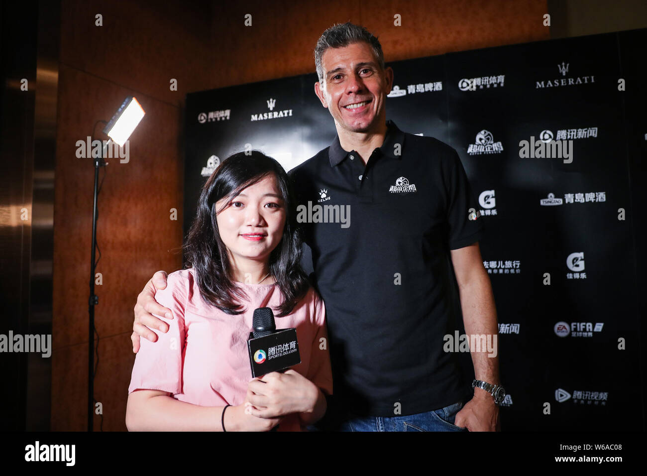 Italian former football player Francesco Toldo, right, poses for photos with a fan during an interview ahead of the 2018 Super Penguin Soccer Celebrit Stock Photo