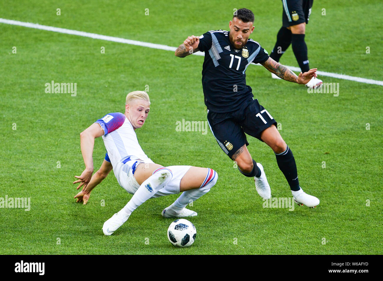Nicolas Otamendi of Argentina, right, challenges Hordur Bjorgvin Magnusson of Iceland in their Group D match during the 2018 FIFA World Cup in Moscow, Stock Photo