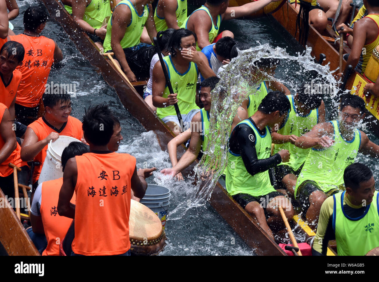 Participants compete in a dragon boat race held to celebrate the Dragon
