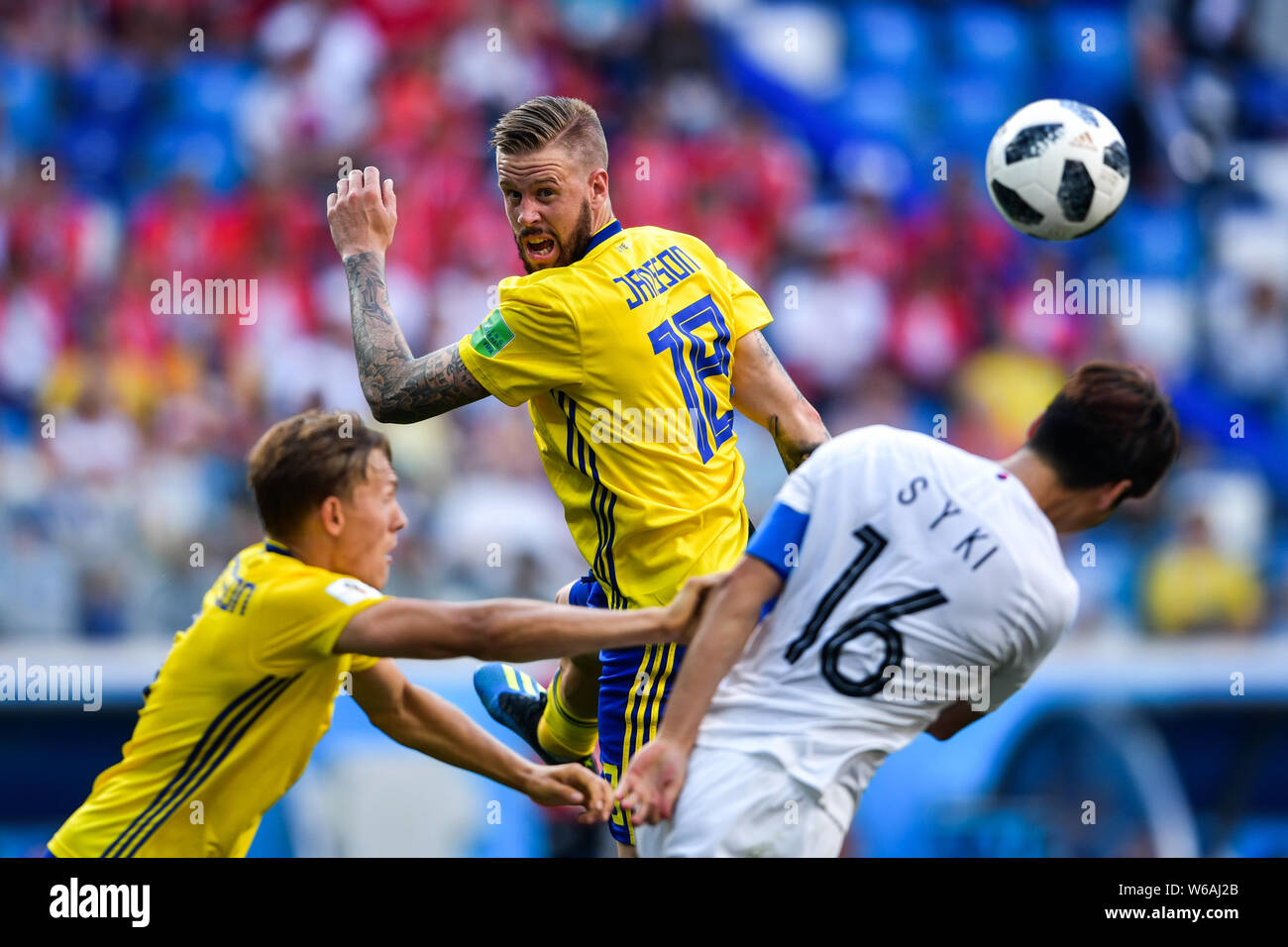Pontus Jansson of Sweden, center, challenges Ki Sung-yueng of South Korea in their Group F match during the FIFA World Cup 2018 in Nizhny Novgorod, Ru Stock Photo