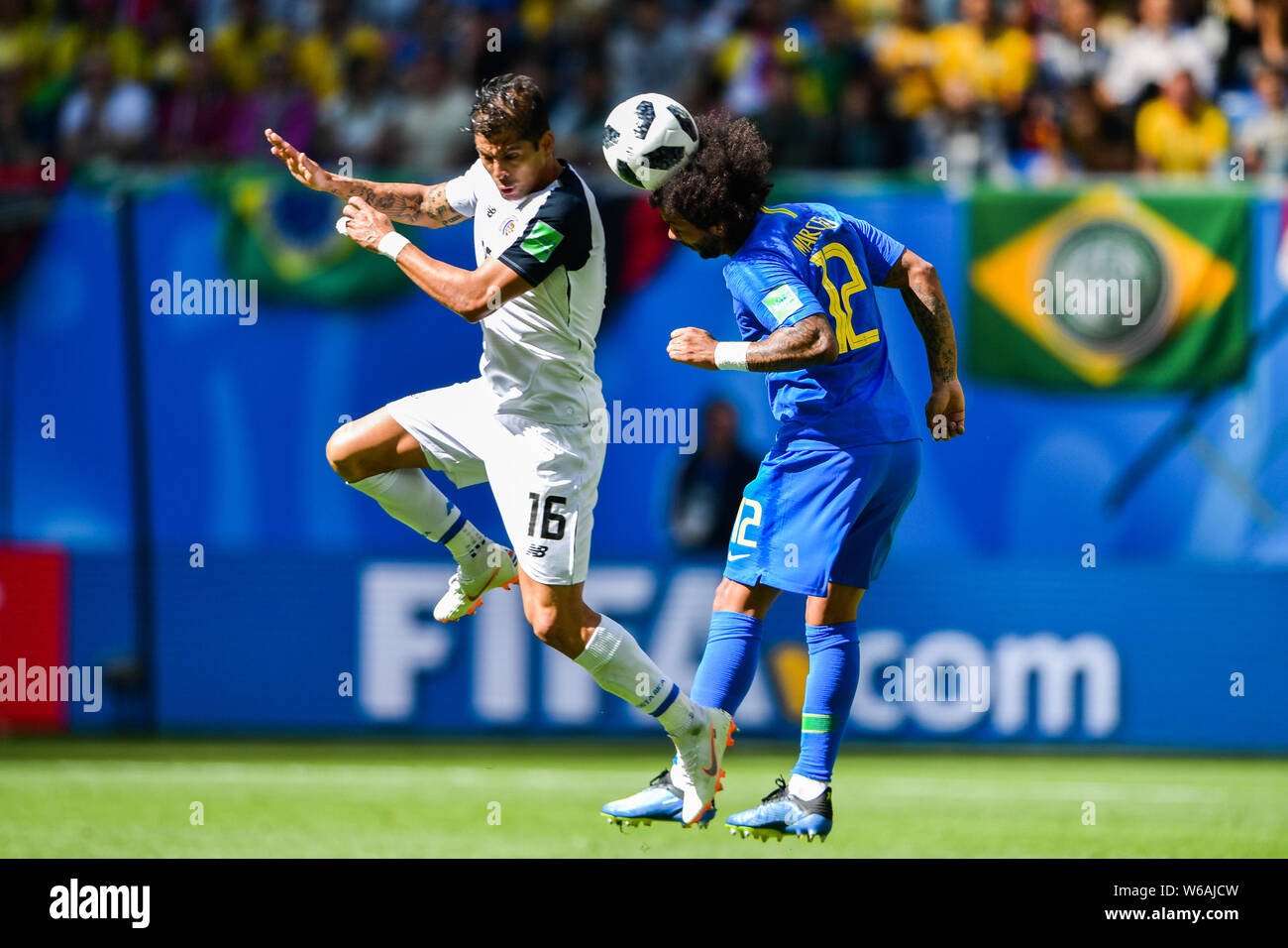 Marcelo, right, of Brazil heads the ball to make a pass against Cristian Gamboa of Costa Rica in their Group E match during the FIFA World Cup 2018 in Stock Photo