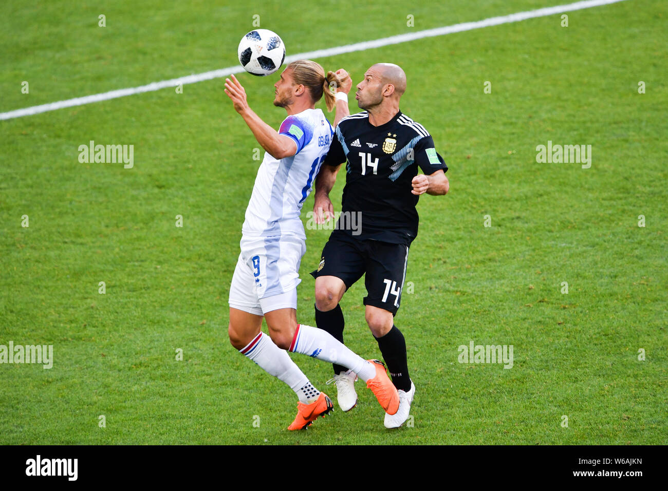 Javier Mascherano of Argentina, right, challenges Rurik Gislason of Iceland in their Group D match during the FIFA World Cup 2018 in Moscow, Russia, 1 Stock Photo