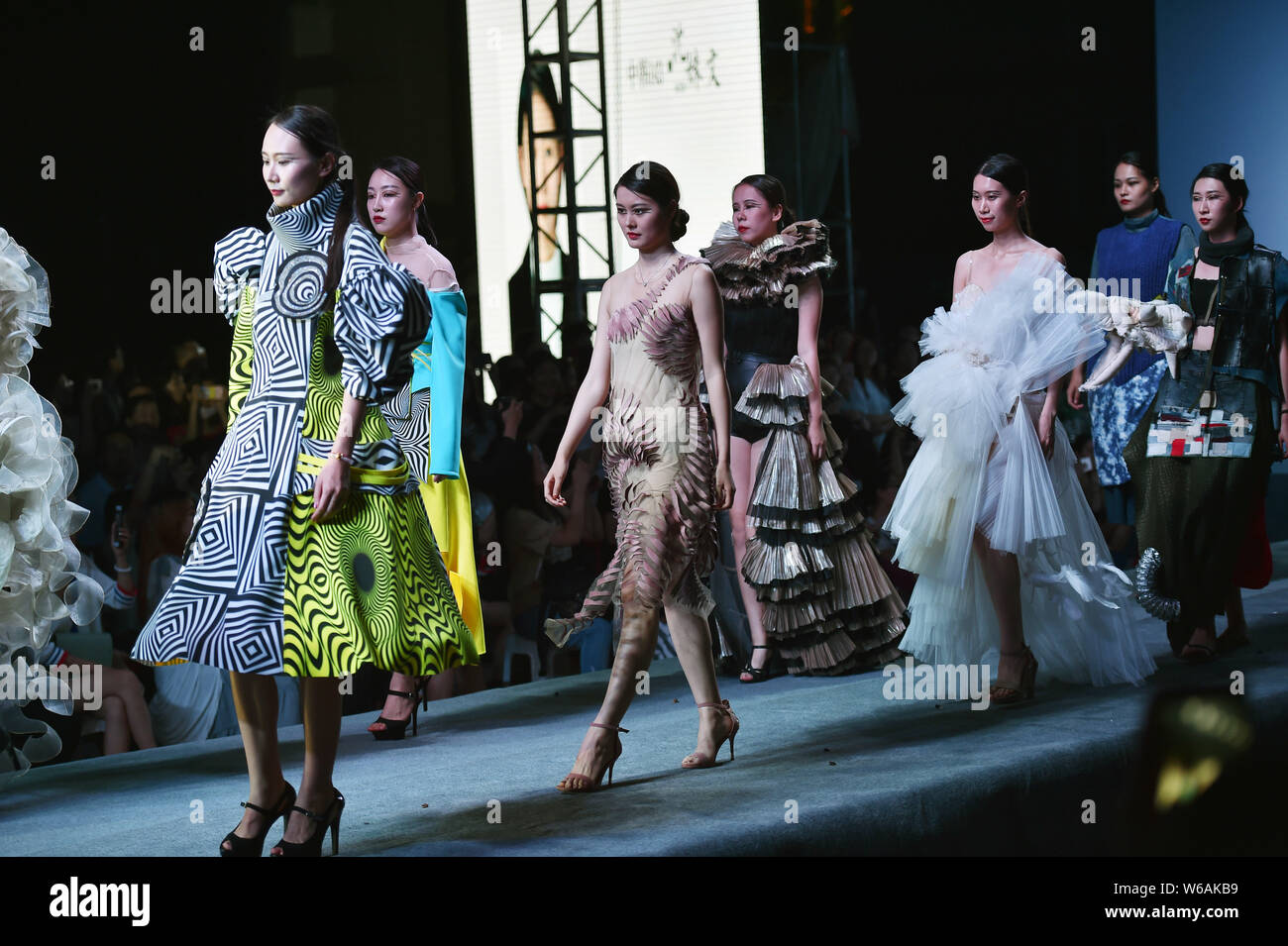Models display new creations during a graduation show held by the ...