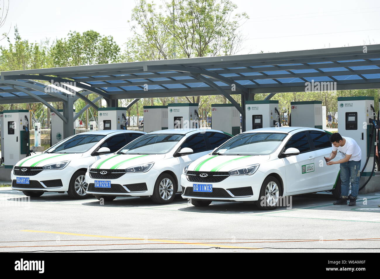 Chery electric vehicles (EVs) are being charged at a charging station in the Xiong'an Citizen Service Center in Rongcheng county, one part of the new Stock Photo