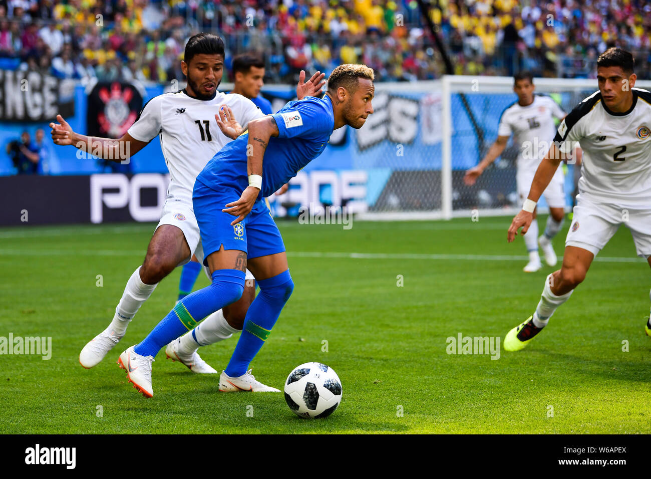 Neymar, center, of Brazil dribbles against Johan Venegas and Johnny Acosta of Costa Rica in their Group E match during the FIFA World Cup 2018 in Sain Stock Photo