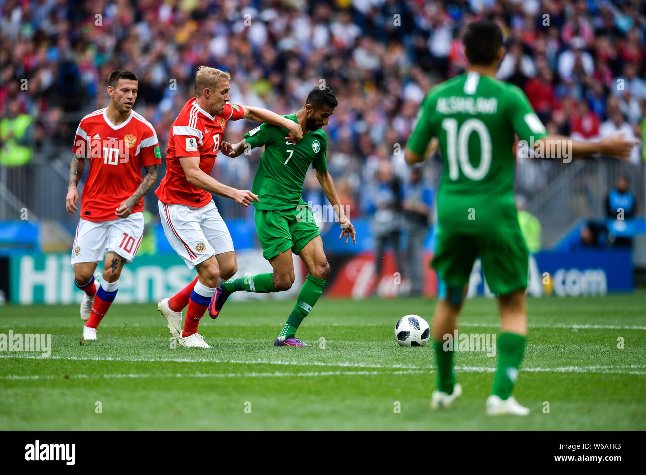 Yury Gazinsky of Russia, left, challenges Daler Kuzyayev of Saudi Arabia in their Group A match during the 2018 FIFA World Cup in Moscow, Russia, 14 J Stock Photo