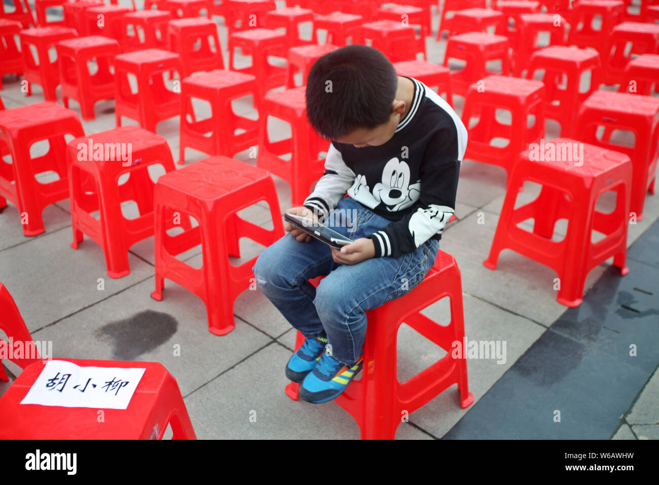 FILE--A young boy plays electronic games on an XBOX ONE game console at a  physical store of Microsoft in Shanghai, China, 26 December 2014. Produc  Stock Photo - Alamy