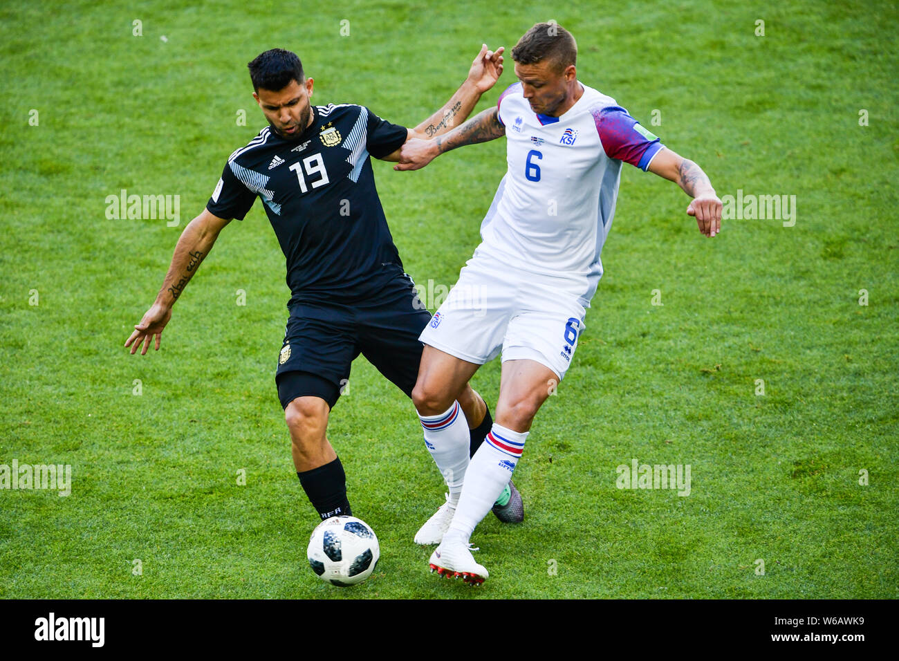 Sergio Aguero of Argentina, left, challenges Ragnar Sigurdsson of Iceland in their Group D match during the 2018 FIFA World Cup in Moscow, Russia, 16 Stock Photo