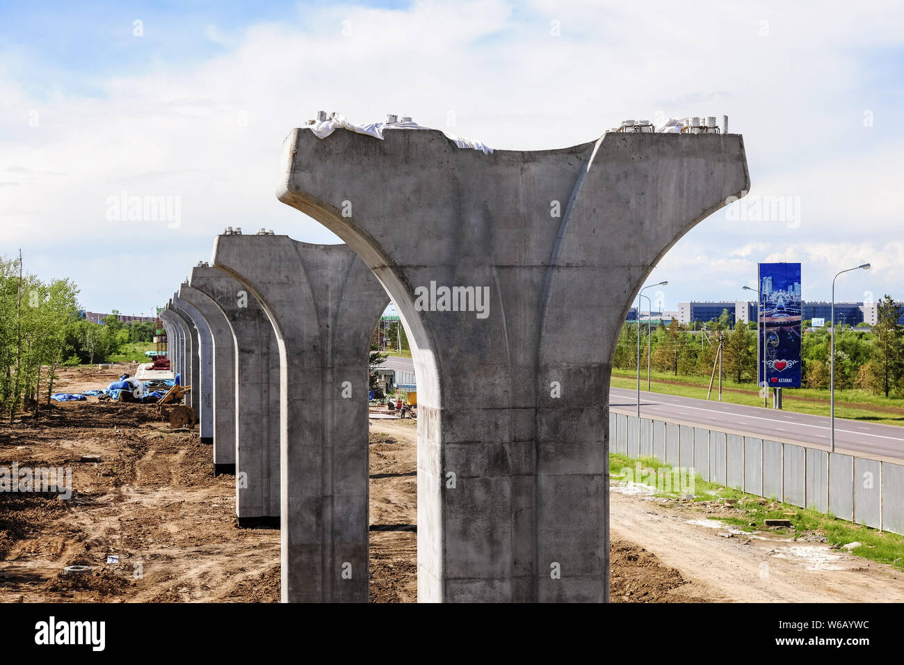 Chinese workers labor at the construction site of Kazakhstan's first