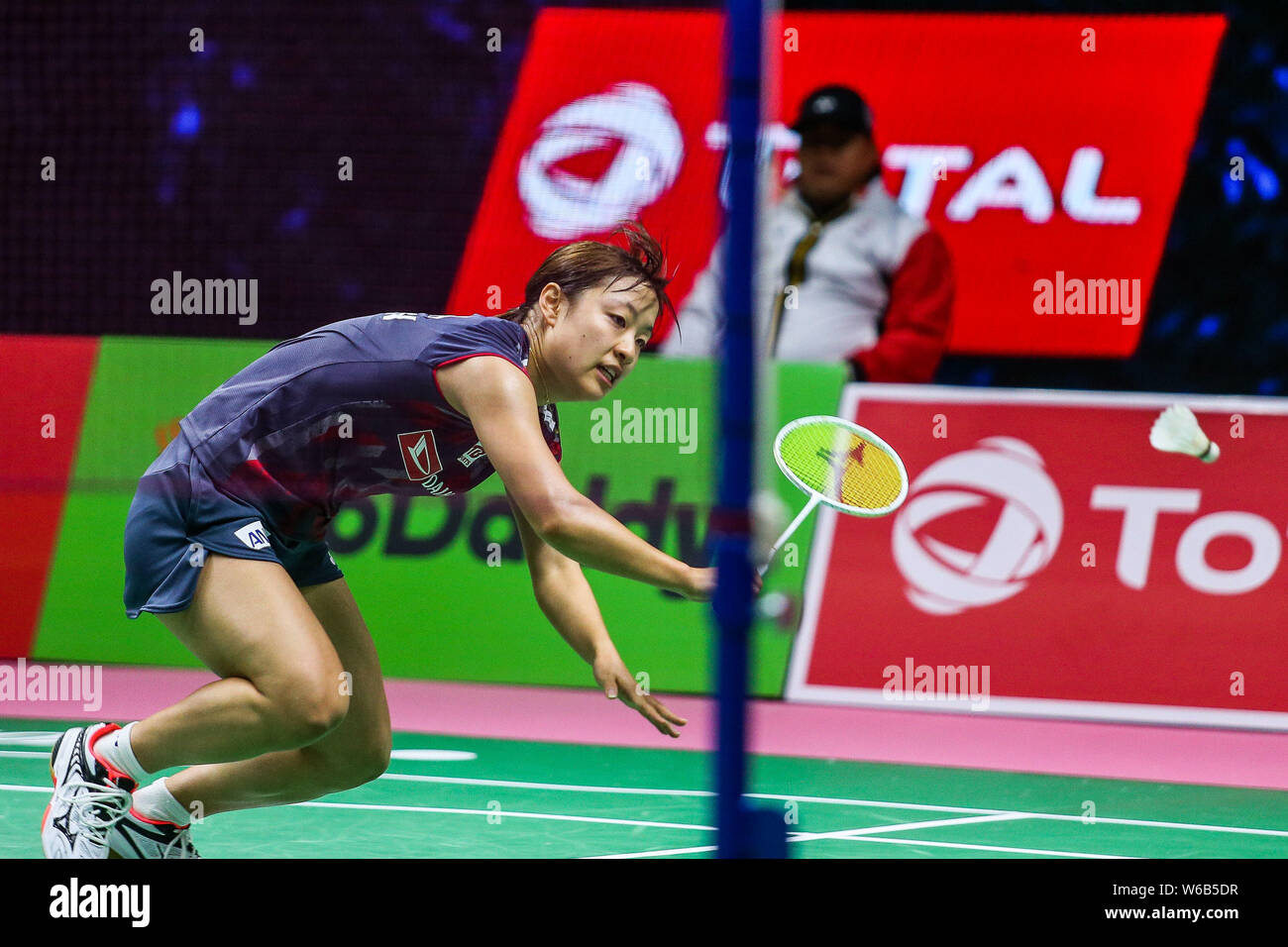 Nozomi Okuhara of Japan competes against Michelle Li of Canada in their womens singles of the Group A match during the TOTAL BWF Thomas and Uber Cup Fi Stock Photo