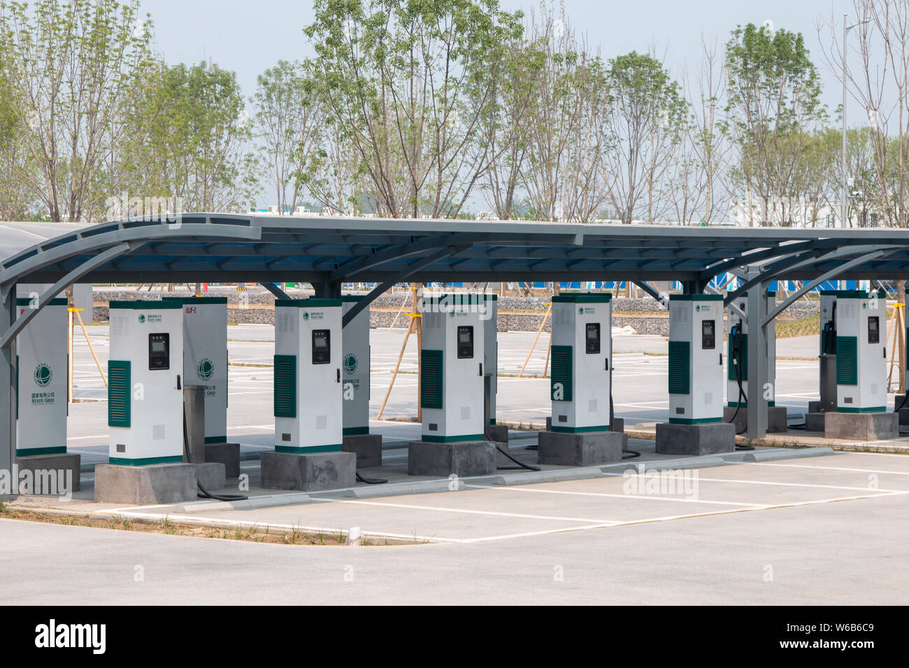 A view of charging piles for shared electric cars at the Citizen Service Center in Rongcheng county, one part of the new special economic zone Xiong'a Stock Photo