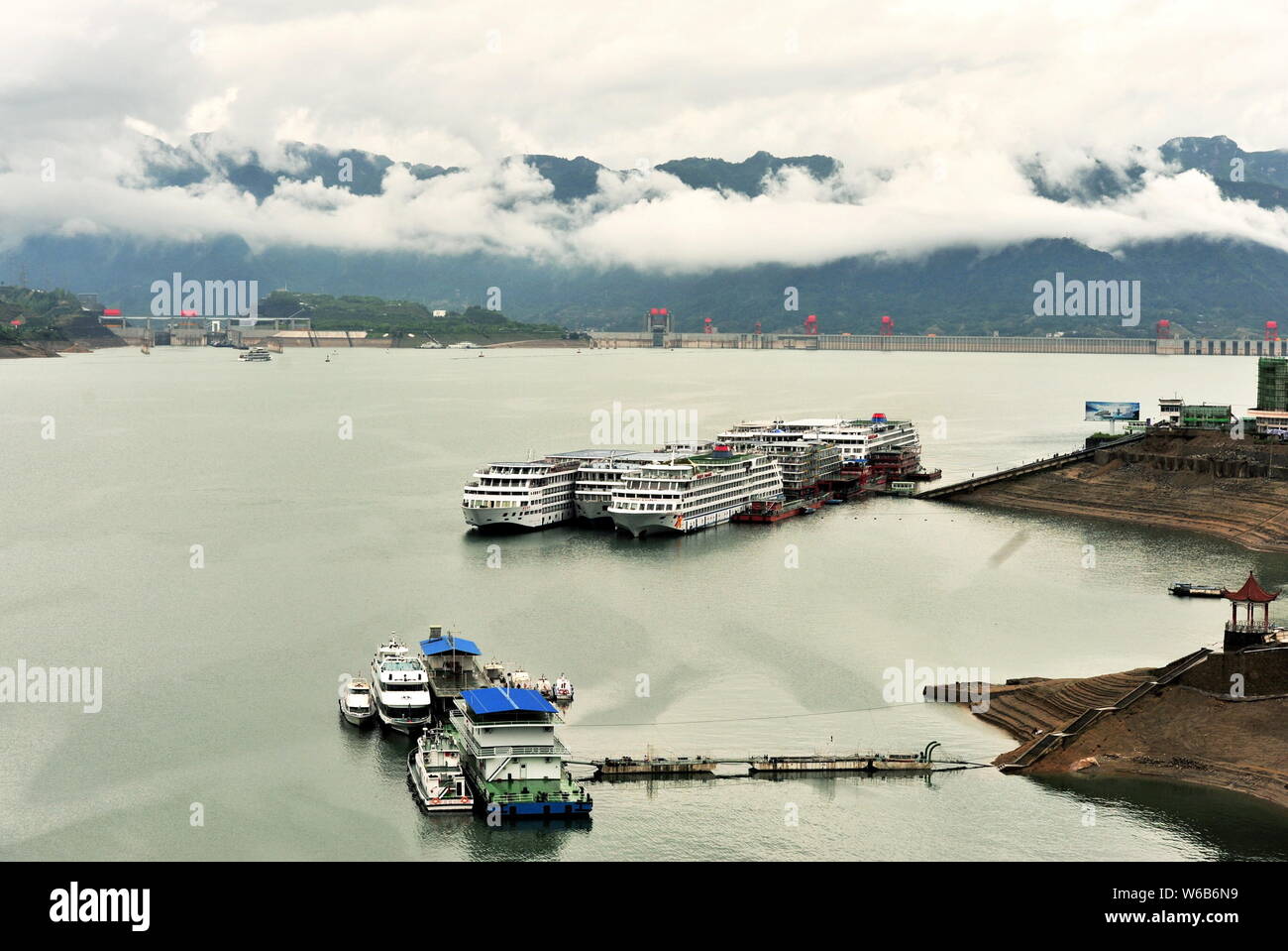Aerial view of the Three Gorges Dam embraced by fog after rainfall in Zigui county, Yichang city, central China's Hubei province, 6 May 2018. Stock Photo