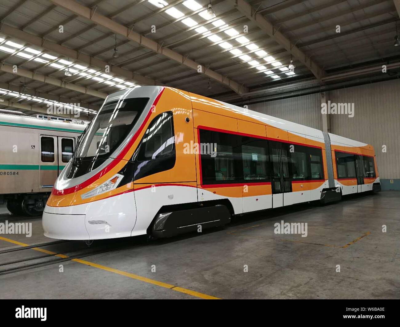 A super hybrid-powered tramcar to be the first tram put into use in the Qinghai-Tibet Plateau is pictured during the off-line ceremony at CRRC Qingdao Stock Photo