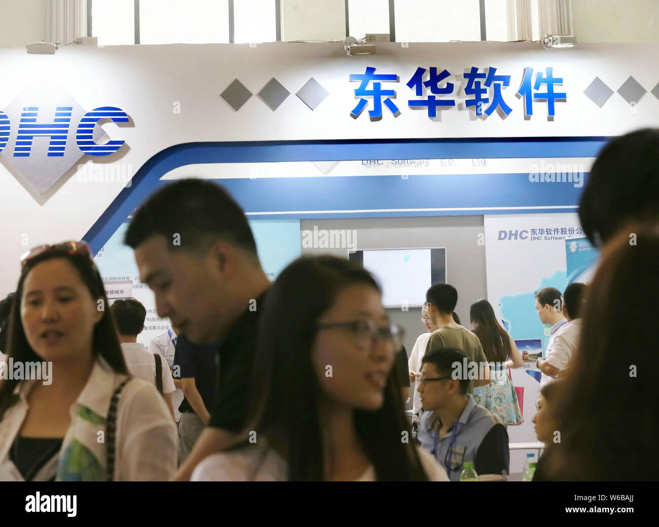 --FILE--People visit the stand of software provider DHC Software in Beijing, China, 27 May 2015.    A unit of Tencent Holdings will buy China's major Stock Photo