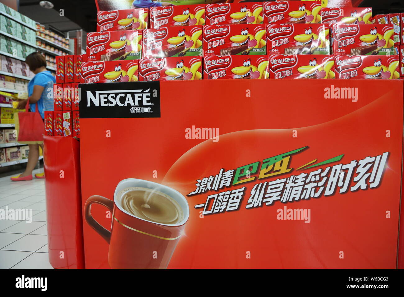 --FILE--Cartons of Nescafe instant coffee of Nestle are for sale at a supermarket in Xuchang city, central China's Henan province, 29 June 2014.    Sw Stock Photo