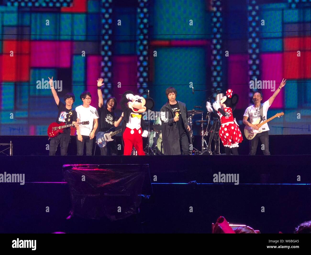Members of Taiwanese rock band Mayday and entertainers dressed in costume  of Mickey Mouse and Minnie Mouse perform during the Mayday 2018 Life Tour  co Stock Photo - Alamy