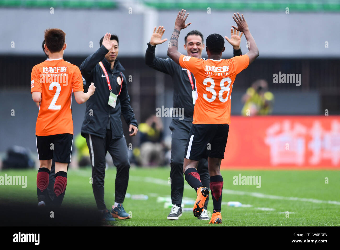 Cameroonian football player Benjamin Moukandjo, right, of Beijing Renhe celebrates with his head coach Luis Garcia Plaza after scoring against Guangzh Stock Photo