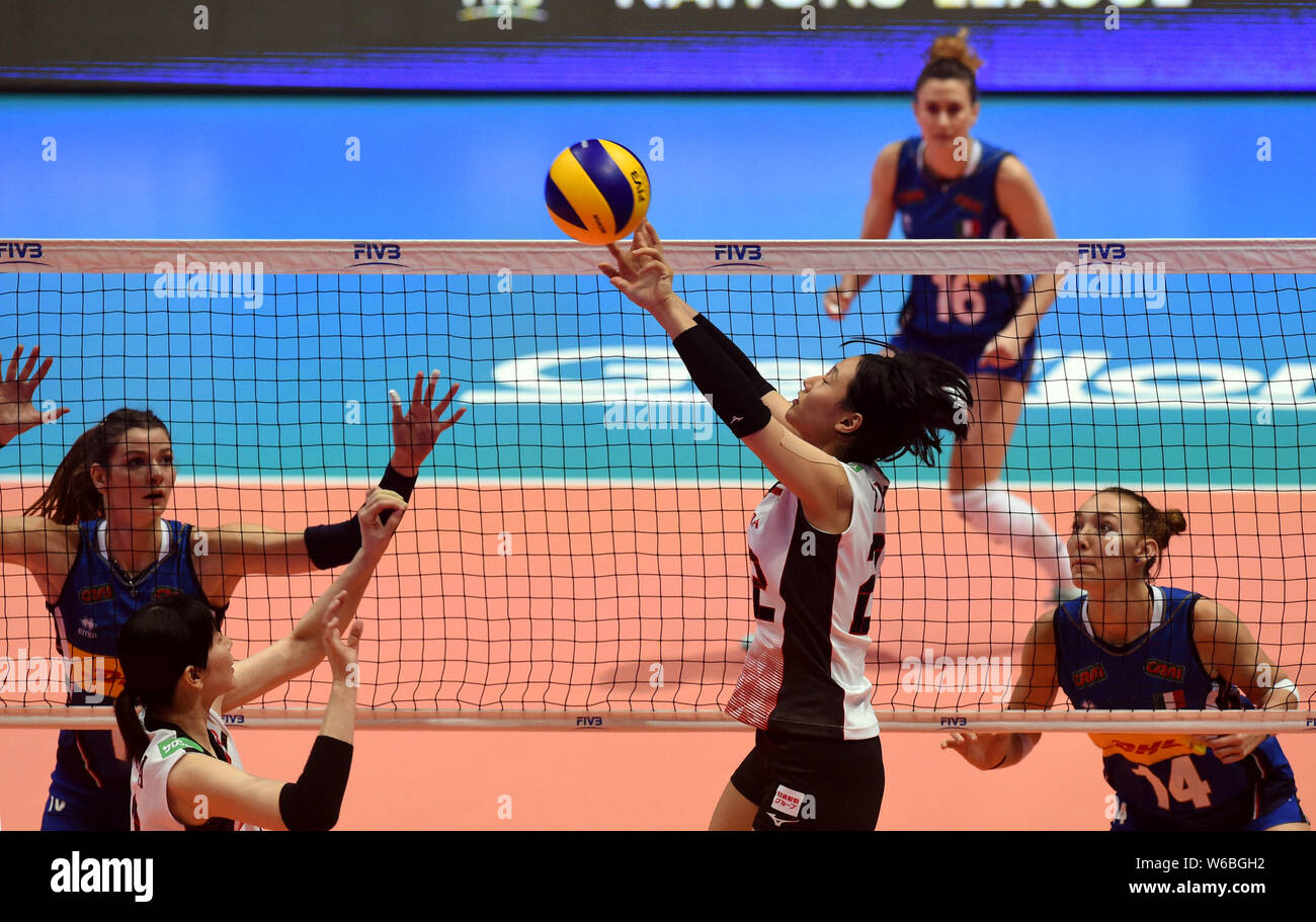 Kanami Tashiro, top, of Japan spikes against Elena Pietrini of Italy in